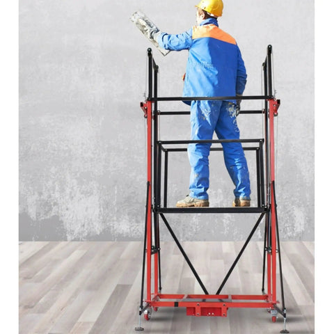 Worker painting on Versatile Electric Scaffolding Platform With Remote Control And Wheels Mobile Cargo Elevator indoors