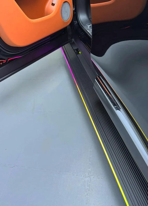 Plug And Play Deployable Running Boards For Tesla Cybertruck showcasing custom LED strip lights and sleek design.