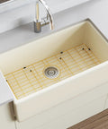 Rock Solid Gold 304 Stainless Steel Sink Grid Protector Covers 28 by 14 Inch Single Bowl with Rear Drain, positioned in a kitchen sink.