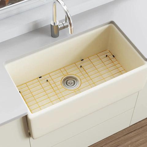 Rock Solid Gold 304 Stainless Steel Sink Grid Protector Covers 28 by 14 Inch Single Bowl with Rear Drain, positioned in a kitchen sink.