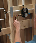 Installing Universal Shower Diverter Rough-In Valve With MultiChoice Inlets And Outlets champagne bronze in bathroom remodel
