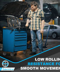 4 Inch Heavy Duty Casters Set Of 4 With Swivel Brake Wheels mounted on a blue toolbox in an auto shop.