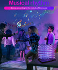 Party scene with people dancing, featuring 3D LED Cube Kit For DIY Electronics on a table with dope lighting effects.