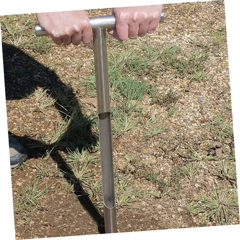Person using T Handle Garden Soil Sampler Probe Stainless Steel Tool For Quick Soil Testing In Yard And Lawn Durable Reusable Design