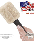 Hand holding Two Color Faux Finish Paint Roller Kit For Beginners with sheepskin roller, Made in USA, and American flag in background.