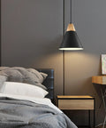Bedroom setting with Dope Black Pendant Light Two Pack 9.4 Inch Farmhouse Modern Pendant Lighting, wood accent, sleek black finish above nightstand.