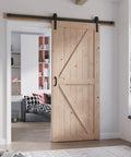 36 Inch By 84 Inch Wood Barn Door With Six Point Six Feet Hardware Kit Included K Shape Solid Spruce Panel Interior Sliding Door For Home Or Office Rustic Modern Look Easy Assembly Smooth Quiet Track System Durable Construction installed in a home interior.