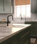 hansgrohe Talis N Pull Down Kitchen Faucet, Modern, Magnetic Hand Sprayer, 1-Handle, 1.75 GPM, Matte Black, 72867671 on kitchen island with marble countertop.