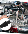 Barista using espresso machine with Heat Resistant Steam Wand Safety Guard Sleeve For Espresso Machines Fireproof Silicone Cover Protects Hands During Frothing Milk Universal Fit Easy Slip On Heat Shield For Barista Gear shown.