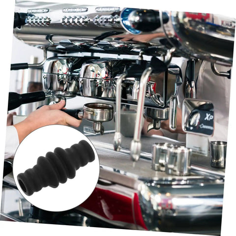 Barista using espresso machine with Heat Resistant Steam Wand Safety Guard Sleeve For Espresso Machines Fireproof Silicone Cover Protects Hands During Frothing Milk Universal Fit Easy Slip On Heat Shield For Barista Gear shown.