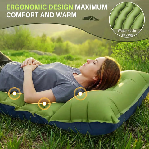 Person lying on green Ultralight Camping Sleeping Pad With Built In Pillow And Foot Pump, 3 Inch Thick Self Inflating Pad outdoors