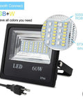 Close-up of 2 Pack 60W RGBW LED Flood Lights with Bluetooth App Control, IP66 Waterproof, LED details shown.