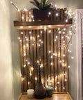 Lit Up Willow Vine Lights For Indoor Or Outdoor Decor With Plug In Power Flexible Faux Plant displayed in cozy living room setup
