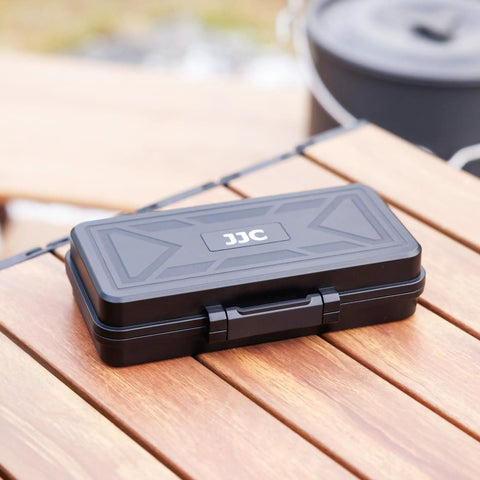 Black All In One Camera Battery And Memory Card Storage Case For Pro Gear on wooden table