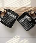Funny Engineer Gifts Ceramic Mug 11 Oz Black For Engineers hanging upside down with text "Understanding Engineers" on the side.