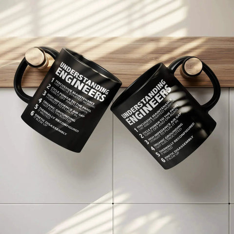Funny Engineer Gifts Ceramic Mug 11 Oz Black For Engineers hanging upside down with text "Understanding Engineers" on the side.