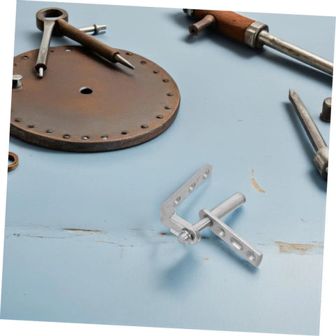 Stainless Steel Self Closing Cafe Door Hinge With Heavy Duty Build And Dual Swing Operation For Wood Doors And Kitchen Or Bar Cabinets, Rock Solid Pivot Hinges For Smooth, Hands Free Access, angled view of hinge parts on blue surface