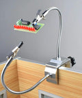 Soldering Third Hand Tool with tabletop clamp, flexible nickel plated arms, rotatable alligator clips holding circuit board.