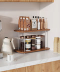 Two Tier Adjustable Bathroom Counter Organizer holding coffee supplies on countertop near coffee maker.