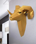 Golden geometric bull head wall decor mounted on grey wall, modern design for stylish home interior.