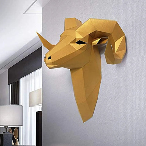 Golden geometric bull head wall decor mounted on grey wall, modern design for stylish home interior.