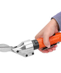 One Quarter Inch Air Shears Pneumatic Metal Cutter With Steel Straight Blade held by a hand, showing its compact size and durable build.