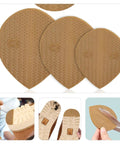 Three light brown polyurethane shoe heel repair pads, half round sole protectors for sneakers and athletic kicks.