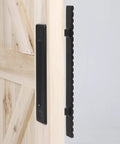 Side view of Solid Brass Sliding Barn Door Handles Set, 12 Inch Heavy Duty Two Sided Design, black finish on wooden door