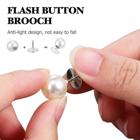 Close-up of a hand holding a pearl cleavage cover safety pin with a metal backing, demonstrating use for garment styling.