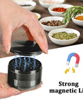 3 Inch Spice Grinder For Kitchen Gray With Aluminum Alloy Build, showing magnetic lid in use with herbs and spices