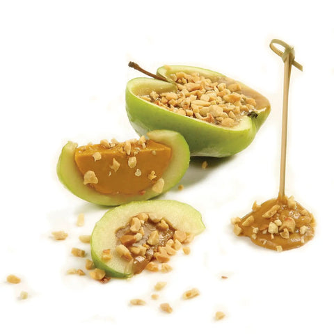 Caramel apple slices topped with chopped nuts using No Fuss Nut And Topping Chopper For Quick Snack Prep And Ice Cream Toppings