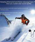 Skier wearing Motorcycle Helmet Bluetooth Headset with Waterproof Sports Sound System Hands Free Music and Call Control Auto Answer 60 Hour Play Time Clear HiFi Audio Dual Device Pairing Solid 20 Meter Range for Riding, skiing on snow-covered mountain with clear blue sky.