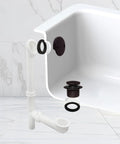 Heavy Duty 14 Inch Bathtub Waste And Overflow Assembly With Kick Style Drain Plug And Two Hole Faceplate Oil Rubbed Bronze visible attached to tub.