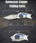 Fish Style Folding Knife With Ladder Pattern Damascus Blade And Blue Resin Handle, shown open and closed on stone background