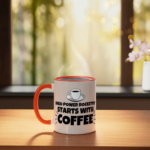 High Power Rocketry Starts With Coffee Mug 11 Ounce Ceramic Cup Orange White With Glossy Finish on a table