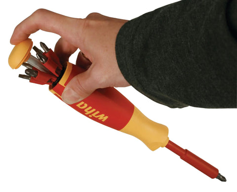 Hand holding Insulated Pop Up Bit Holder Set Fourteen Piece Magnetic One Quarter Inch Drive For Slotted Phillips Square Bits