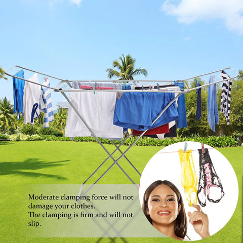 Solid Fifty Six Colorful Clothespins With Heavy Duty Spring Clips Measuring Two Inches For Everyday Drying And Diy Crafts Plus A Nifty Black Storage Bag To Keep Your Laundry Room Clean And Ready. Drying clothes outdoors on a laundry rack.