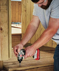 Man using 20V Max Impact Driver With Battery And Charger Included; one quarter inch chuck, 2700 RPM for deck construction.