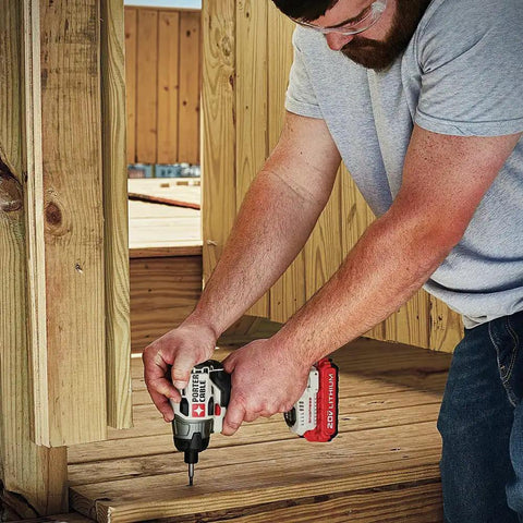 Man using 20V Max Impact Driver With Battery And Charger Included; one quarter inch chuck, 2700 RPM for deck construction.