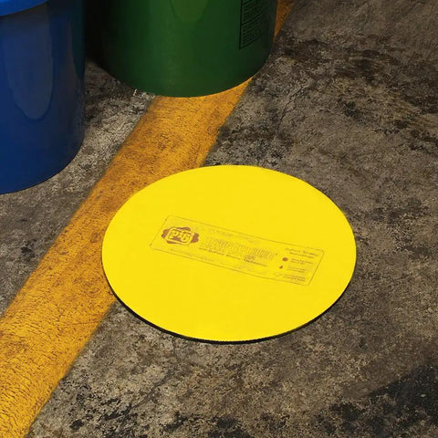 Beefy Heavy Duty Storm Drain Cover For Round Drains Up To 6 Inches Diameter, yellow vinyl top, on industrial floor for protection
