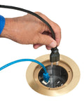 Hand plugging cables into Recessed Power And Data Round Floor Box For Concrete Floors With Brass Finish Fits Most 4.5 Inch Inside Diameter PVC Round Boxes 15 Amp Decora Style Outlet Opening And Low Voltage Keystone Data HDMI Phone Cable