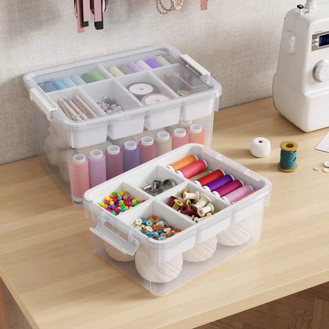Stackable 40Qt Storage Bins With Lids And Trays, filled with arts and crafts supplies, clear plastic latching boxes with dividers.