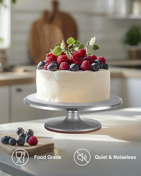 Puroma 12-inch aluminum rotating cake turntable with non-slip silicone bottom, supporting a frosted berry-topped cake