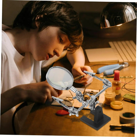 Person using Adjustable Third Hand Soldering Station With Magnifying Glass And Dual Alligator Clips For PCB Repair