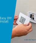 Person installing Smart Wi-Fi Thermostat for Home Automation and DIY Friendly, Works With Alexa, Energy Star Certified, on wall