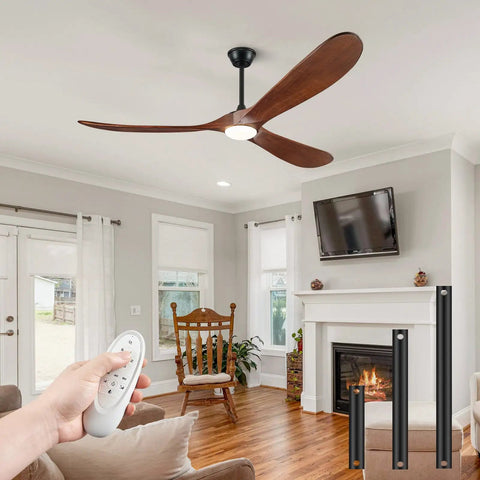 52 Inch Wood Walnut Outdoor Ceiling Fan With Lights And Remote Control in a cozy living room setting, focused on remote use.