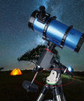 Latitude Adjustment Base For Sky Watcher Star Adventurer, green and white, under telescope on tripod, nighttime astro photography.