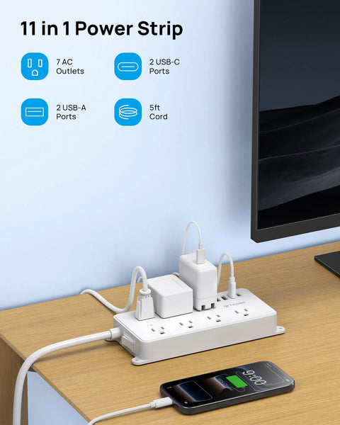 Beefed Up Surge Protector Power Strip With 7 Widely Spaced Outlets 2 USB A And 2 USB C Ports in use on desk with phone charging
