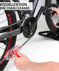 Using Ultimate Bike Chain Cleaning Kit With Deep 360 Degree Clean on bike with red accents, hand holding device on chain.