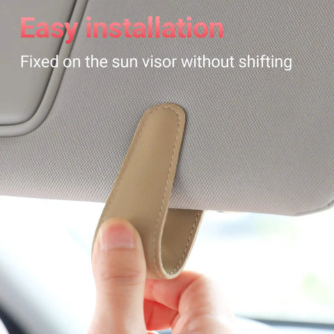 Nifty Beige Sunglass Holder For Car Sun Visor That Snaps Right On to secure glasses, showing easy installation on sun visor.